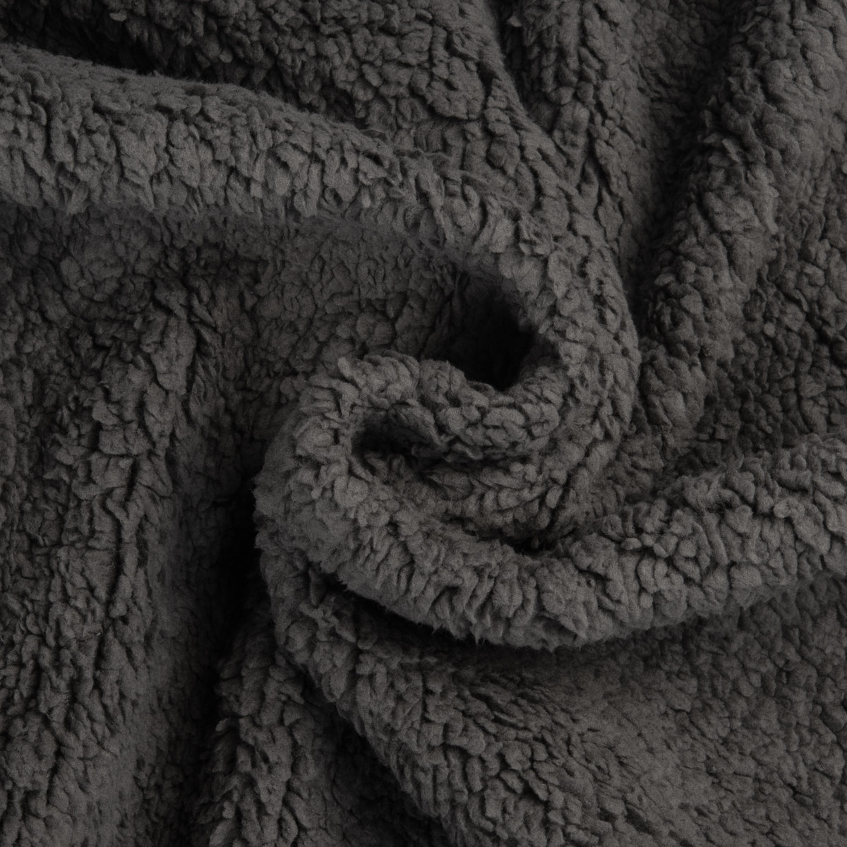 Close-up of the soft sherpa side of a waterproof squirting blanket